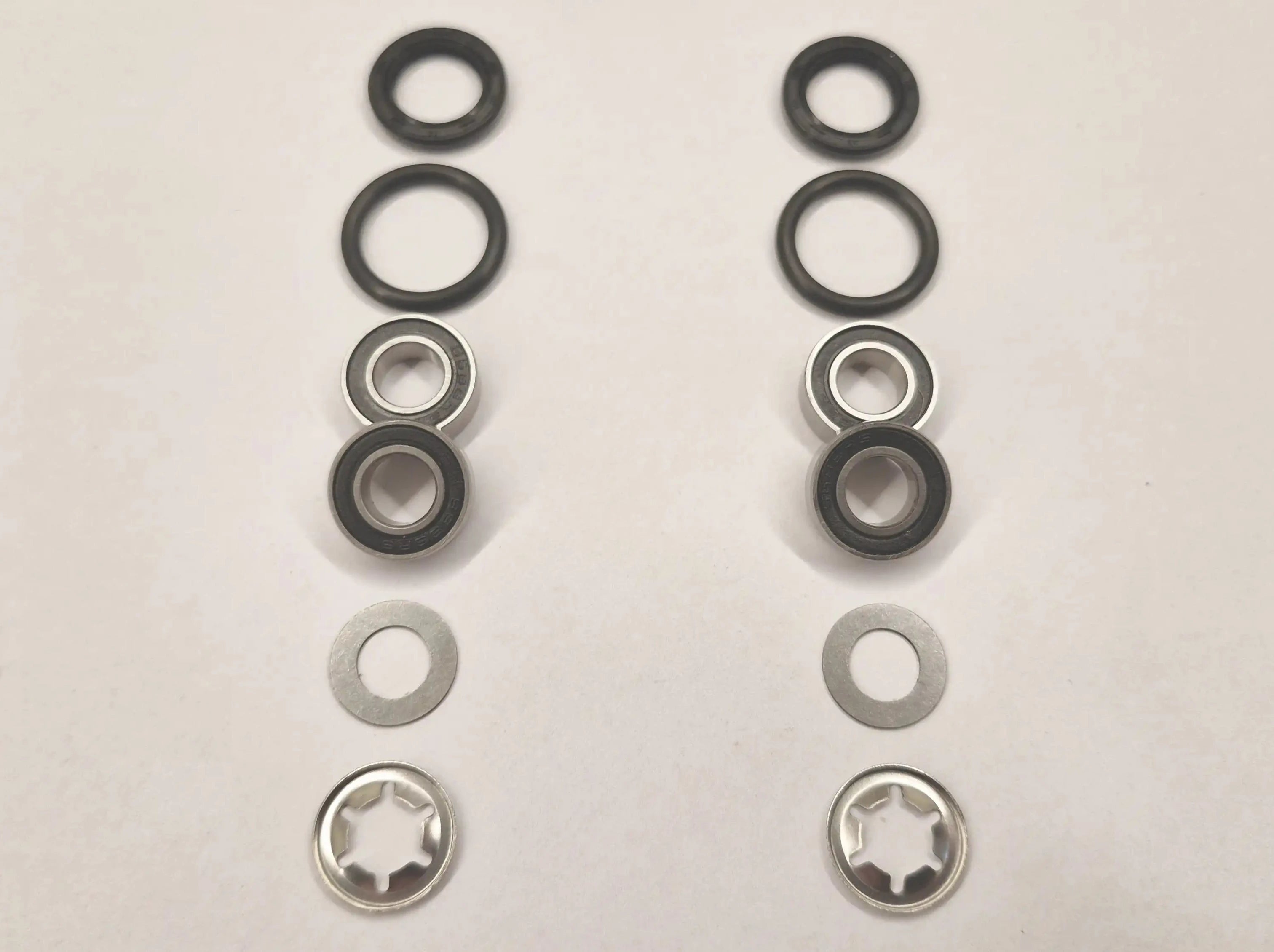 Repair kit for front wheels on Husqvarna Automower with 8mm wheel axle. Stainless bearings and lock washers.