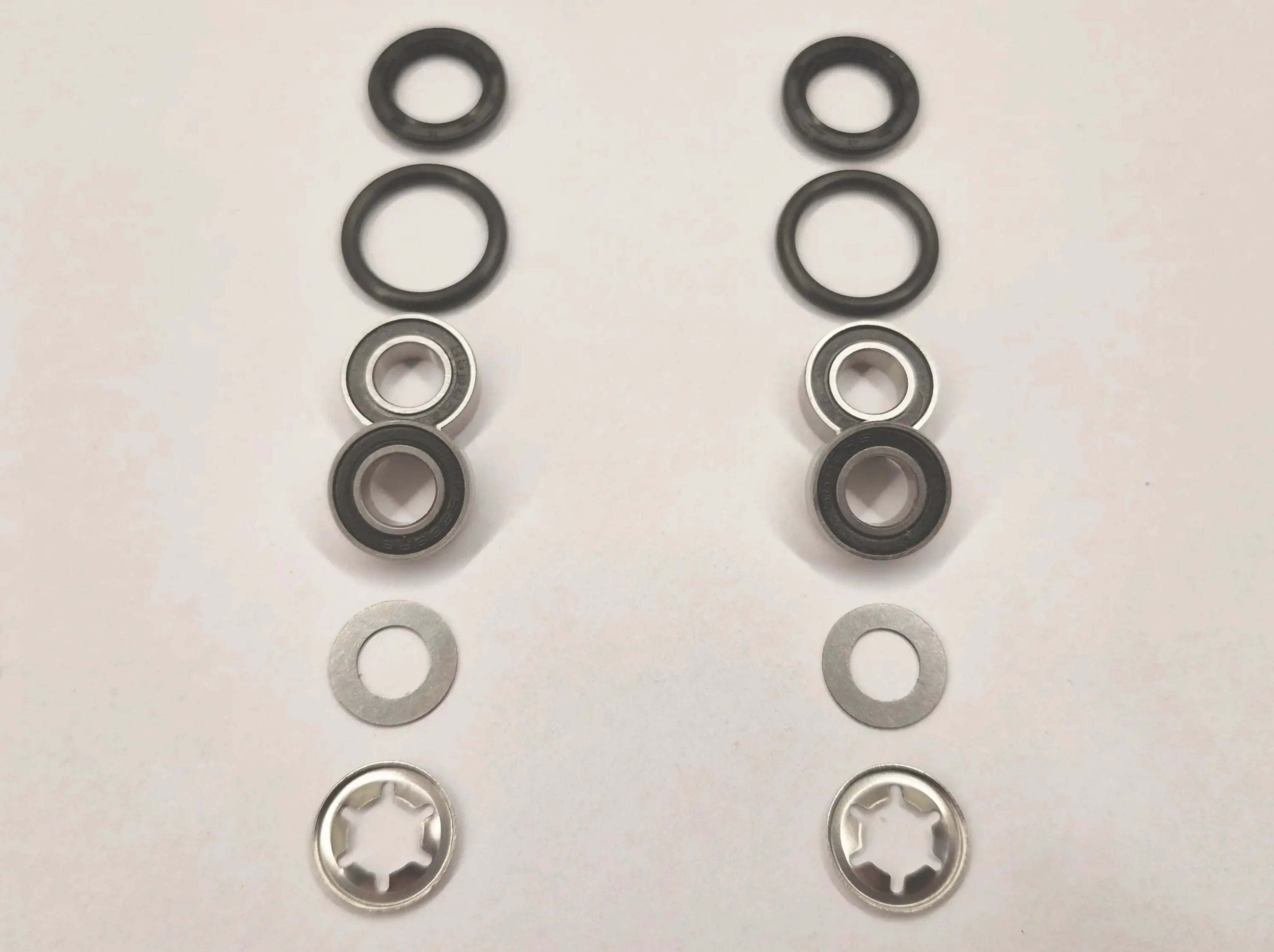 Repair kit for front wheels on Husqvarna Automower with 6mm wheel axle. Stainless bearings and lock washers.